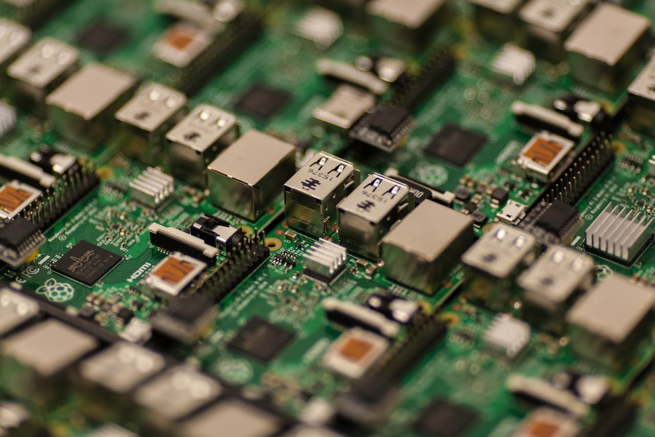 Detailed shot of a Raspberry Pi circuit board showcasing its components, USB ports, and microchips.